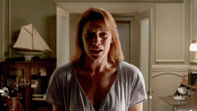 Karen Gillan as Kaylie in Oculus. She is looking straight at the camera and appears scared