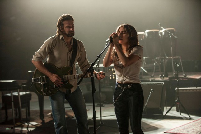 This image released by Warner Bros. shows Bradley Cooper, left, and Lady Gaga in a scene from the latest reboot of the film, "A Star is Born." (Neal Preston/Warner Bros. via AP)