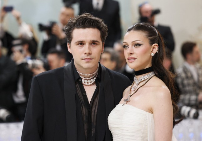 Brooklyn Beckham and Nicola Peltz Beckham pose at the Met Gala, an annual fundraising gala held for the benefit of the Metropolitan Museum of Art's Costume Institute with this year's theme "Karl Lagerfeld: A Line of Beauty", in New York City, New York, U.S., May 1, 2023. REUTERS/Andrew Kelly