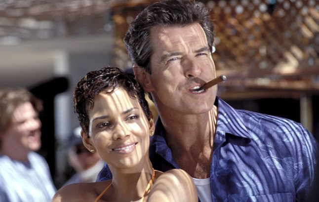 Halle Berry and Pierce Brosnan hugging one another in a still from Die Another Day