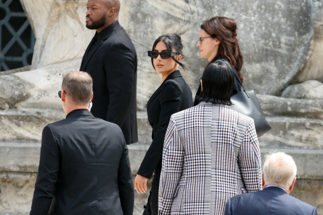 US celebrity Kim Kardashian arrives to the Assize Court for the trial during which she will testify over the 2016 robbery that saw her relieved of millions of dollars' worth of jewellery at gunpoint at in Paris, on May 13, 2025. The trial of this sensational nine million euro jewellery robbery opened in Paris on April 28, 2025. (Photo by Alain JOCARD / AFP) (Photo by ALAIN JOCARD/AFP via Getty Images)