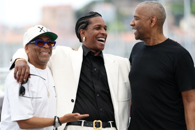 TOPSHOT - US director and executive producer Spike Lee, US actor and singer Asap Rocky and US actor Denzel Washington pose during a photocall for the film "Highest 2 Lowest" at the 78th edition of the Cannes Film Festival in Cannes, southern France, on May 19, 2025. (Photo by Sameer AL-DOUMY / AFP) (Photo by SAMEER AL-DOUMY/AFP via Getty Images)