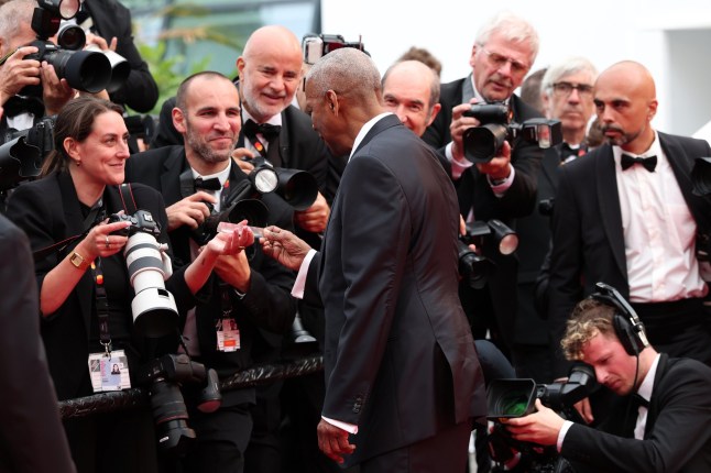 CANNES, FRANCE - MAY 19: Denzel Washington attends the "Highest 2 Lowest" red carpet at the 78th annual Cannes Film Festival at Palais des Festivals on May 19, 2025 in Cannes, France. (Photo by Gisela Schober/Getty Images)