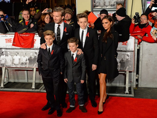 Former Manchester United and England footballer David Beckham, his wife Victoria, and their sons Brooklyn, Romeo and Cruz, pose for pictures at the world premiere of the documentary 'The Class of 92', in London's Leicester Square, on December 1, 2013. AFP PHOTO / LEON NEAL (Photo by LEON NEAL / AFP) (Photo by LEON NEAL/AFP via Getty Images)