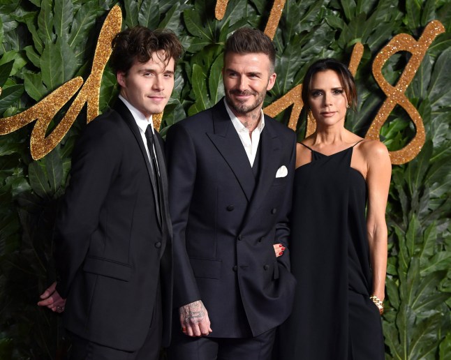 LONDON, ENGLAND - DECEMBER 10: Brooklyn Beckham, David Beckham and Victoria Beckham arrive at The Fashion Awards 2018 In Partnership With Swarovski at Royal Albert Hall on December 10, 2018 in London, England. (Photo by Karwai Tang/WireImage)