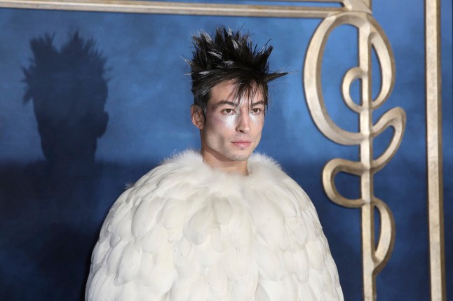 FILE - Actor Ezra Miller poses for photographers upon arrival at the premiere of the film "Fantastic Beasts: The Crimes of Grindelwald," at a central London cinema, Tuesday, Nov. 13, 2018. The actor known for playing "The Flash" in "Justice League" films, who was arrested at a Hawaii karaoke bar, is scheduled to be arraigned on Tuesday, April19, 2022, on charges of disorderly conduct, harassment and obstructing a highway. (Photo by Grant Pollard/Invision/AP,File)